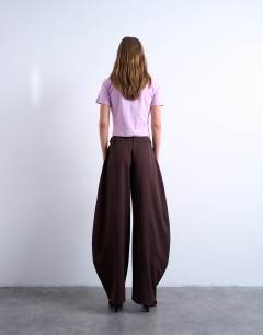 Model wearing Tailored horseshoe leg trouser in chocolate