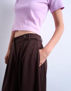 Model wearing Tailored horseshoe leg trouser in chocolate
