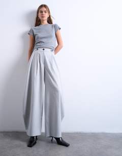 Model wearing Tailored horseshoe leg trouser in grey