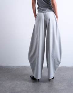 Model wearing Tailored horseshoe leg trouser in grey