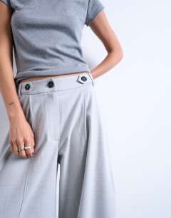 Model wearing Tailored horseshoe leg trouser in grey
