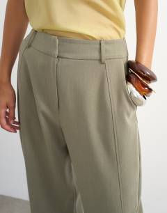Model wearing Tailored horseshoe trouser in sage