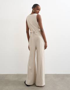 Model wearing Tailored linen jumpsuit in neutral