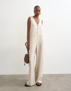 Model wearing Tailored linen jumpsuit in neutral