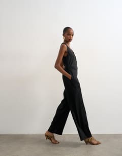 Model wearing Tailored linen jumpsut in black