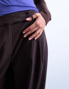 Model wearing Tailored pleated balloon trouser in charcoal