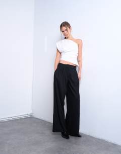 Model wearing Tailored pleated high waist trouser in black