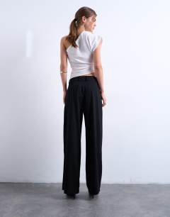 Model wearing Tailored pleated high waist trouser in black