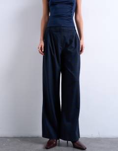 Model wearing Tailored pleated high waist trouser in check