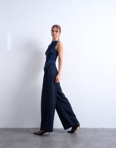 Model wearing Tailored pleated high waist trouser in check