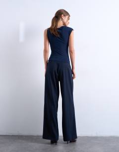 Model wearing Tailored pleated high waist trouser in check