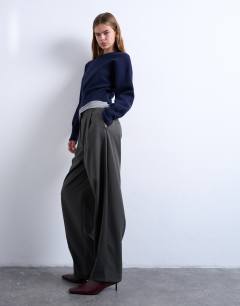 Model wearing Tailored pleated ovoid trouser in charcoal