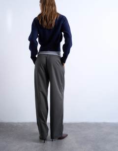 Model wearing Tailored pleated ovoid trouser in charcoal