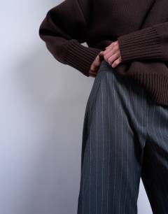 Model wearing Tailored stripe barrel leg trouser in grey