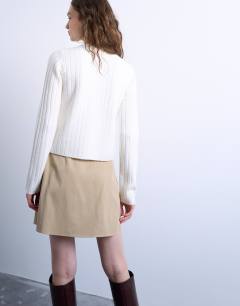 Model wearing Tailored wrap mini skirt in taupe