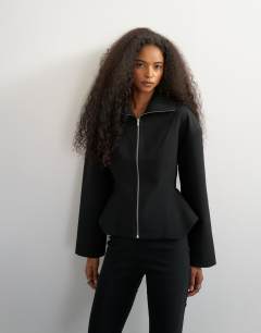 Model wearing Tailored zip through peplum top in black