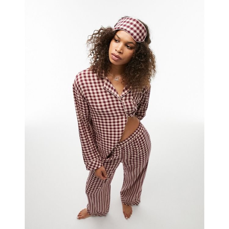 Topshop Tall brushed check piped shirt and trouser pyjama set with eye mask and gift bag in burgundy. 