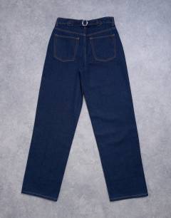 Model wearing Tall Cinch low rise relaxed jean in raw look indigo