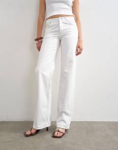 Model wearing Tall Ember low rise straight jean in white