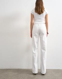 Model wearing Tall Ember low rise straight jean in white