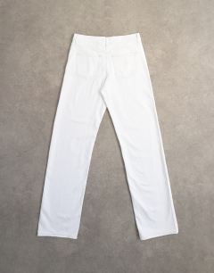 Model wearing Tall Ember low rise straight jean in white