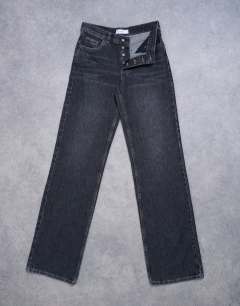 Model wearing Tall Ember low rise straight leg jean in washed black