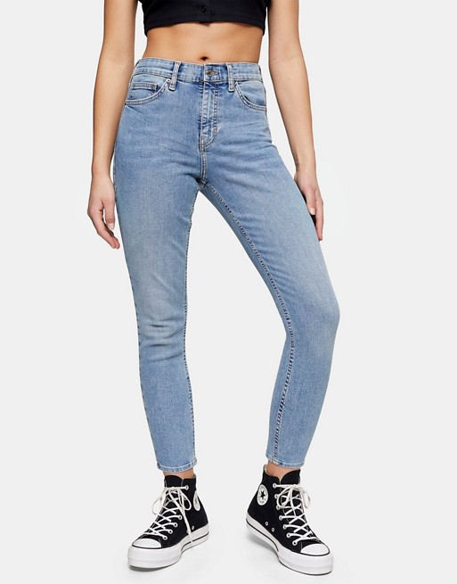 Topshop Petite Jamie jeans with ripped Pocket detailing in mid blue