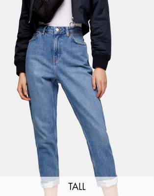 Topshop Tall ripped hem Mom jeans in mid wash - ASOS Price Checker