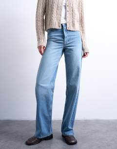 Model wearing Tall mid rise loose fit straight jean in vintage blue