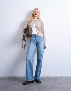 Model wearing Tall mid rise loose fit straight jean in vintage blue