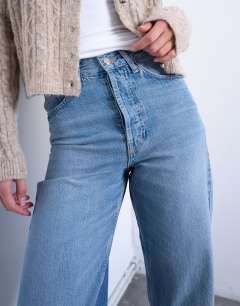 Model wearing Tall mid rise loose fit straight jean in vintage blue