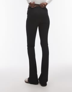 Model wearing Tall skinny rib flared trouser in black