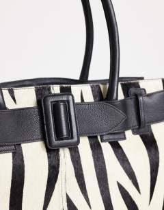 Model wearing Tammy hair on real leather belt detail large tote bag in zebra print