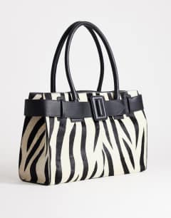 Model wearing Tammy hair on real leather belt detail large tote bag in zebra print