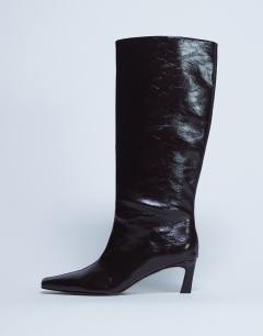 Model wearing Tanya point toe knee high boot in dark chocolate