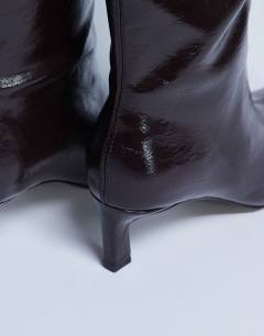 Model wearing Tanya point toe knee high boot in dark chocolate