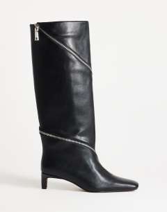 Model wearing Tao zip detail knee high boot in black