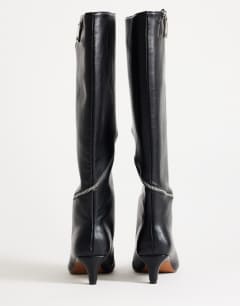 Model wearing Tao zip detail knee high boot in black