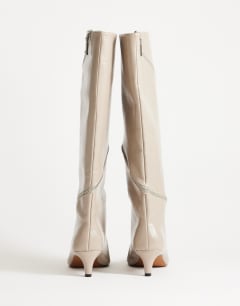 Model wearing Tao zip detail knee high boot in mushroom