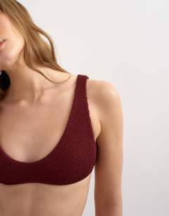 Model wearing Tara crinkle scoop bikini top in aubergine