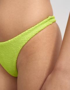 Model wearing Tara crinkle thong bikini bottom in lime