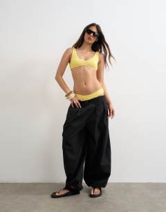 Model wearing Tara scoop bikini top in yellow