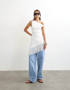 Model wearing Tassel hem asymmetric top in ecru