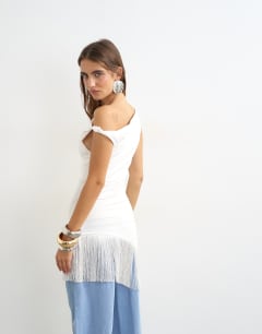 Model wearing Tassel hem asymmetric top in ecru