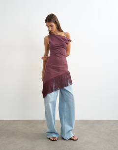 Model wearing Tassel hem asymmetric top in plum