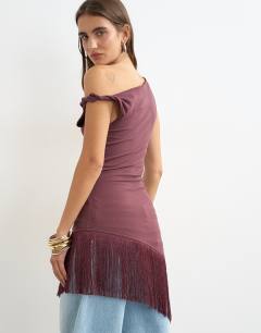 Model wearing Tassel hem asymmetric top in plum