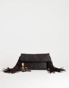 Model wearing Tassel oversized weave clutch bag in chocolate