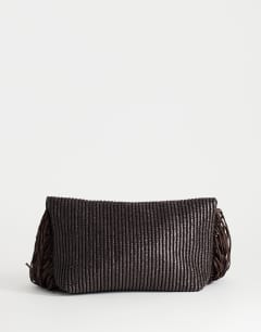 Model wearing Tassel oversized weave clutch bag in chocolate