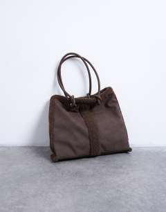 Model wearing Tate shearling tote bag in chocolate