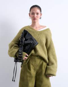 Model wearing Tatum whipstitch tote bag in black